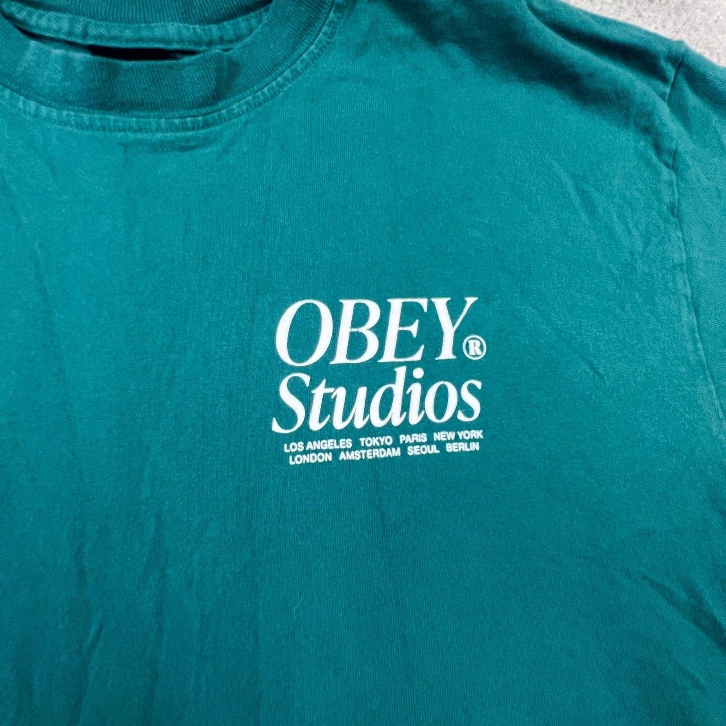 Obey Studios Mens Medium Graphic T-Shirt Teal Green Short Sleeve Crewneck
